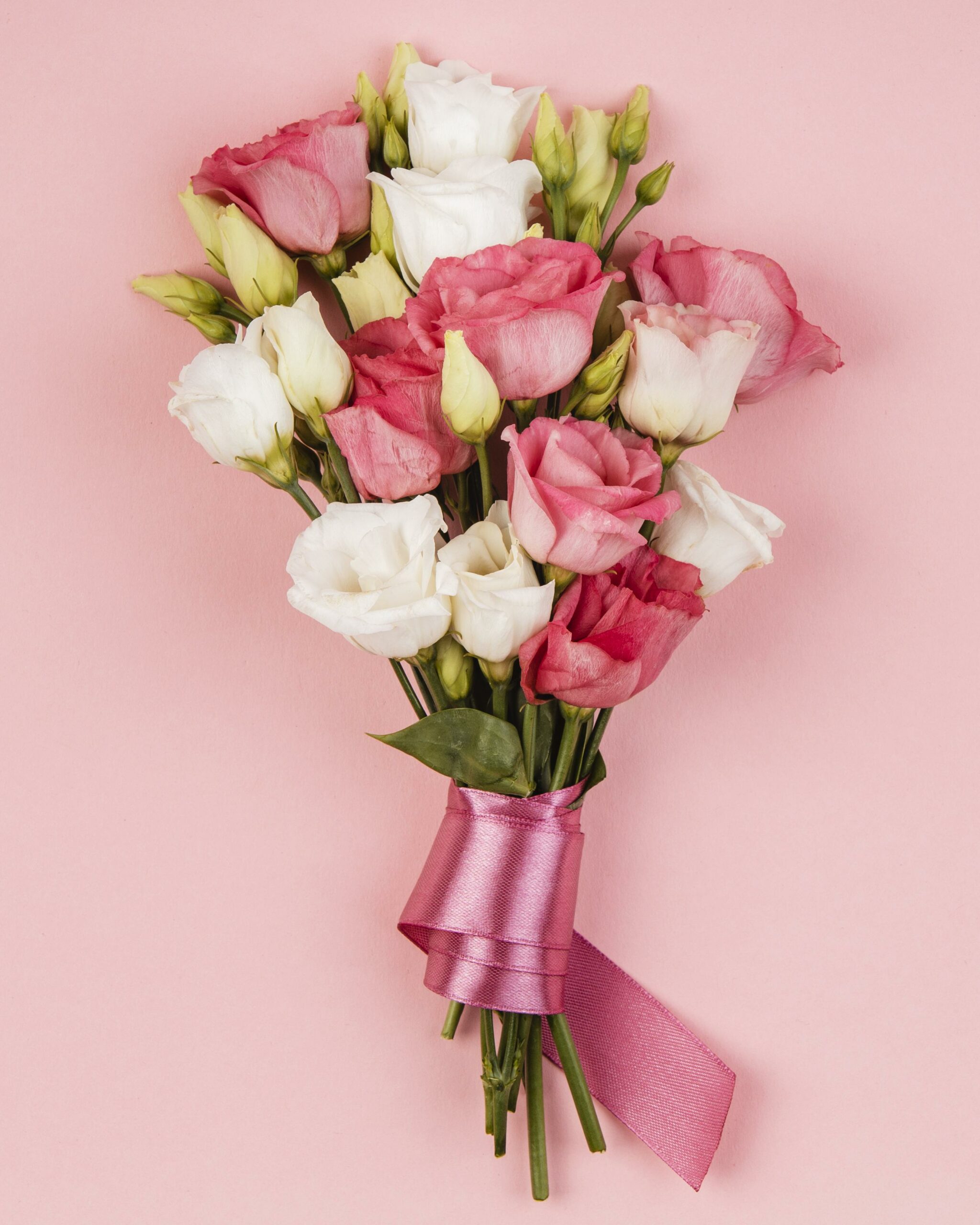 top-view-beautiful-roses-bouquet-with-pink-ribbon